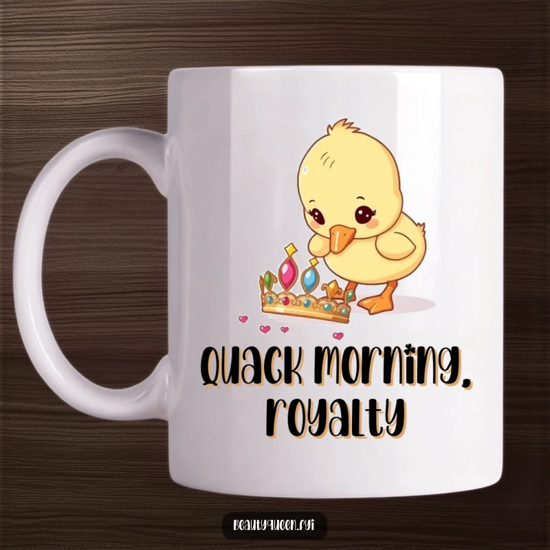 Funny Duckling Mug showing a small, curious duckling intently pecking at a glittering tiara dropped on the ground.