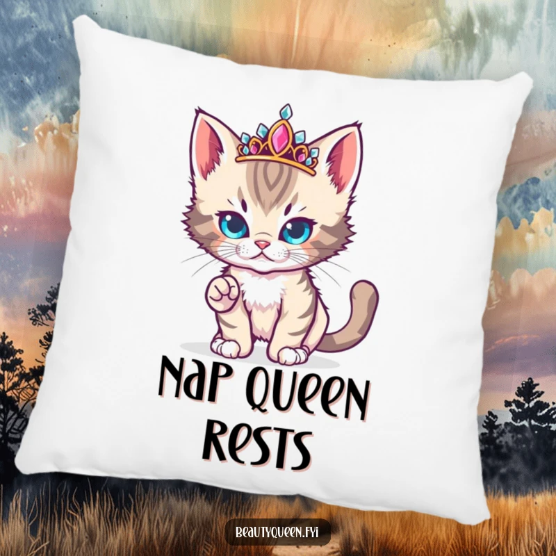 Funny cute kitten with a jeweled tiara strikes a fierce yet adorable runway pose on a pillow.