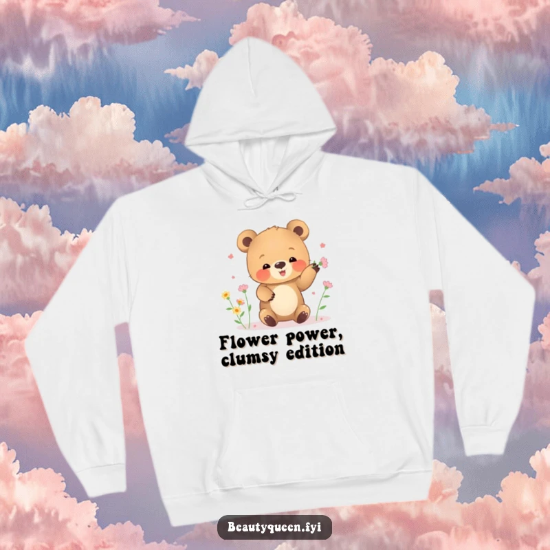 Funny hoodie featuring a small bear cub clumsily juggling a bouquet of tiny blooming flowers.