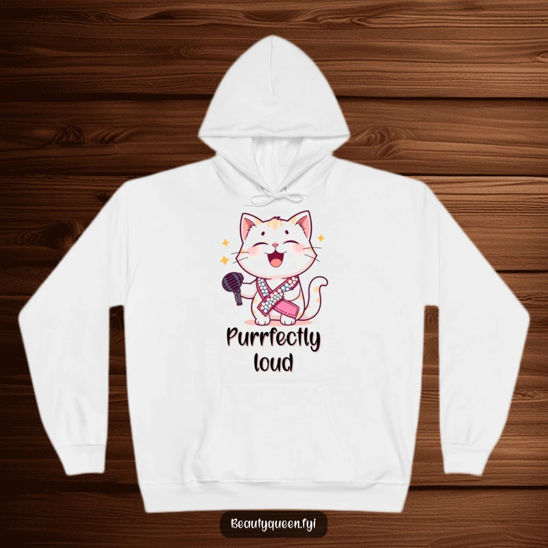 Funny cat hoodie featuring a giggling feline in a dazzling sequined sash, holding a microphone, ready for a hilarious performance and cozy nights.