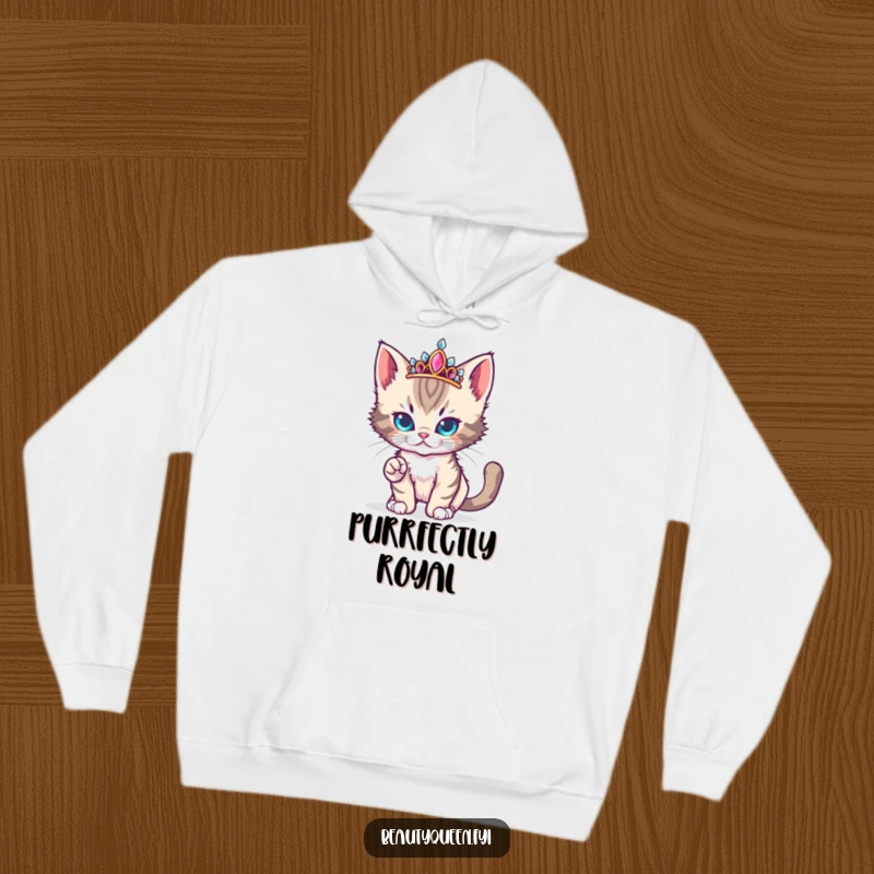 Funny cute kitten wearing a jeweled tiara strikes a fierce yet adorable runway pose on a hoodie.
