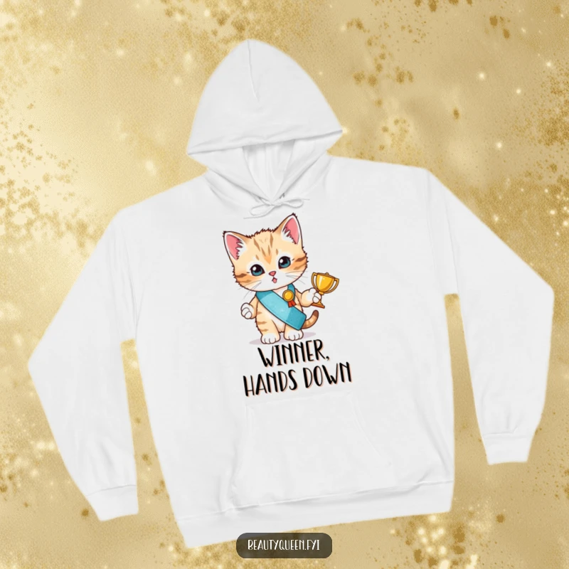 Funny hoodie showcasing a tiny kitten in a glitter sash holding a trophy, embodying a funny, victorious spirit.