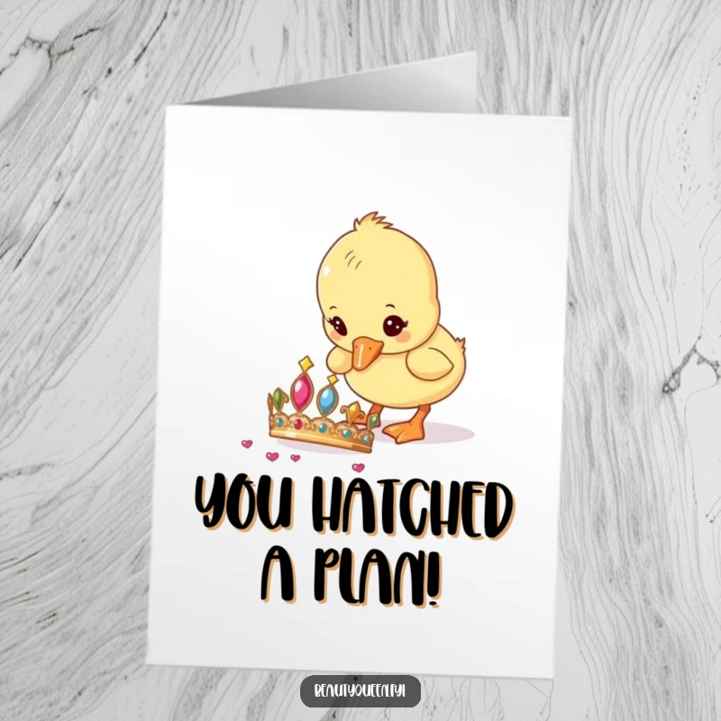 Funny Free Printable Congratulations Card showing a curious duckling investigating and pecking at a shiny, dropped tiara with great interest.