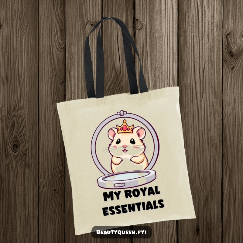 Funny tote bag showing a cute hamster queen in a tiny crown peeking from behind a large compact mirror, ready for royal errands.